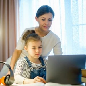 Woman and child using laptop