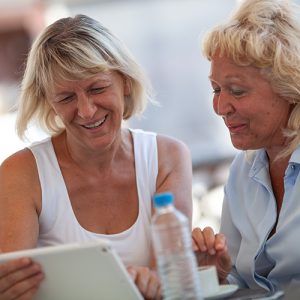 Women using tablet together