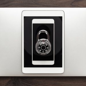 Padlock inside phone screen on top of tablet